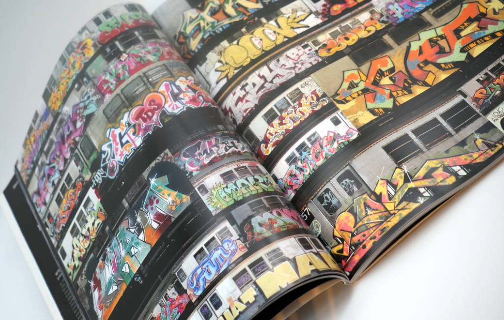 Photo of pages of the book Subway art showing graffiti on trains in New York